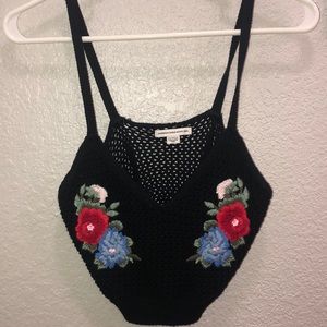 A cute yarn crop top with floral designs